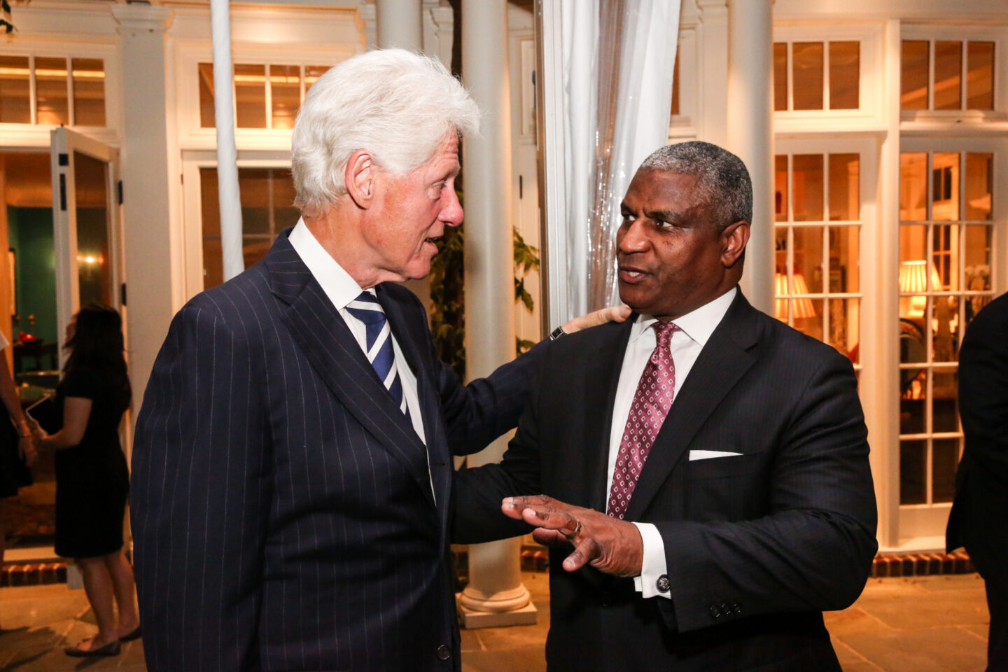President Clinton speaks with former Treasury Secretary Rodney Slater