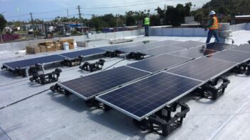 Wide shot of solar panels on a roof
