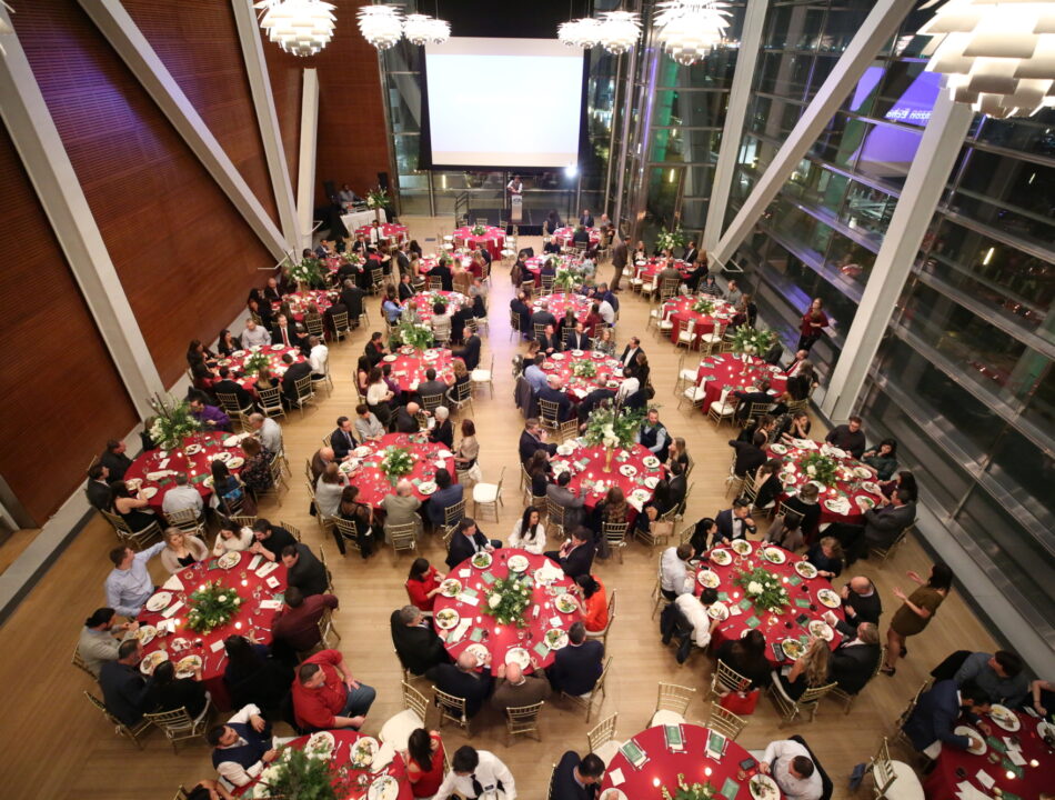 The Clinton Center Great Hall during a holiday event, decorated and filled with guests