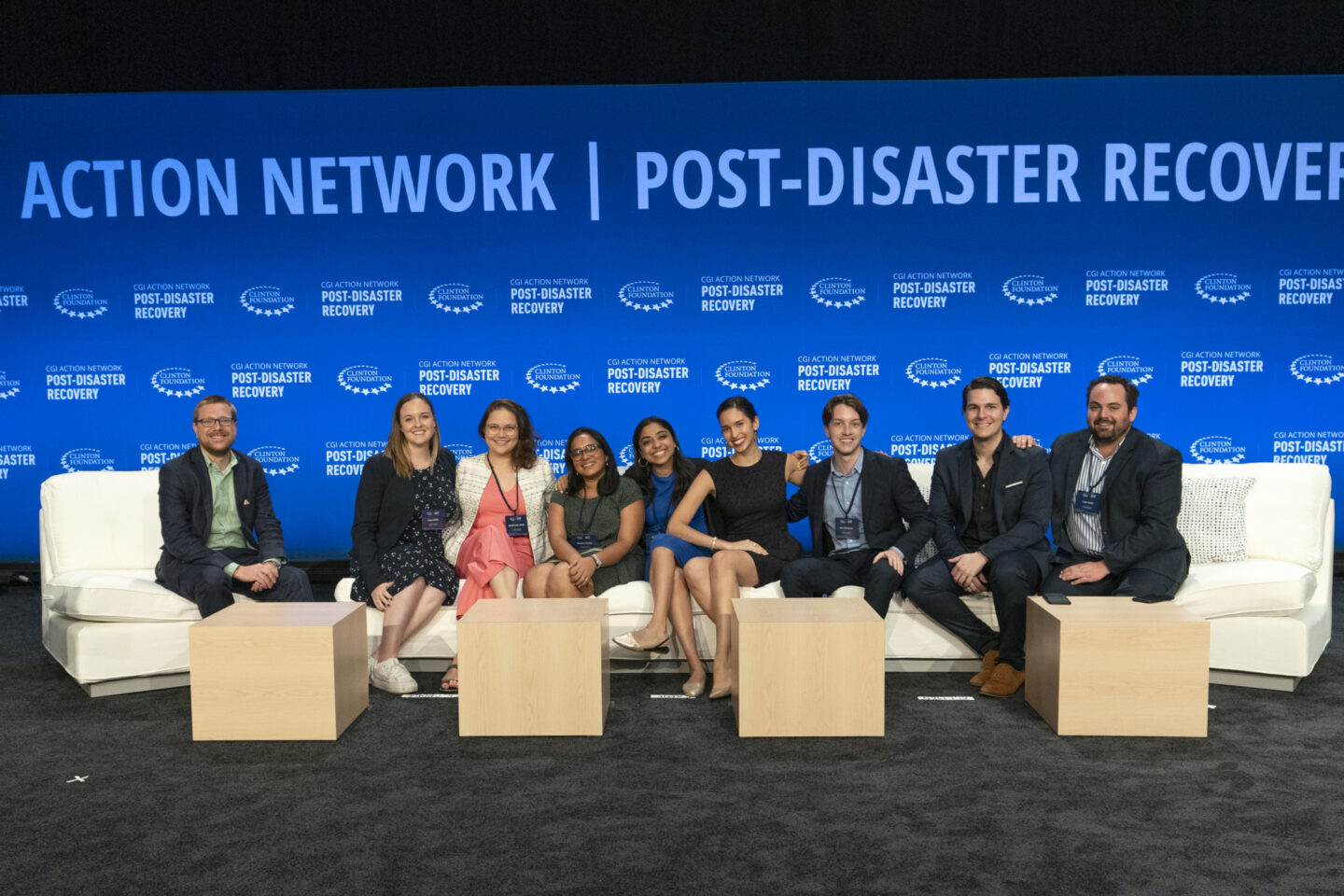 A group of staff members sit together during a Clinton Global Initiative event