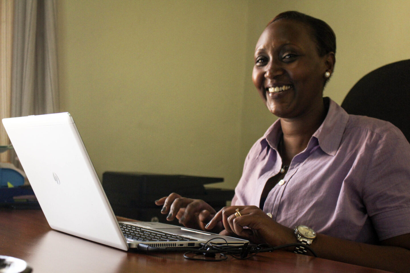 A staff member is pictured at her computer