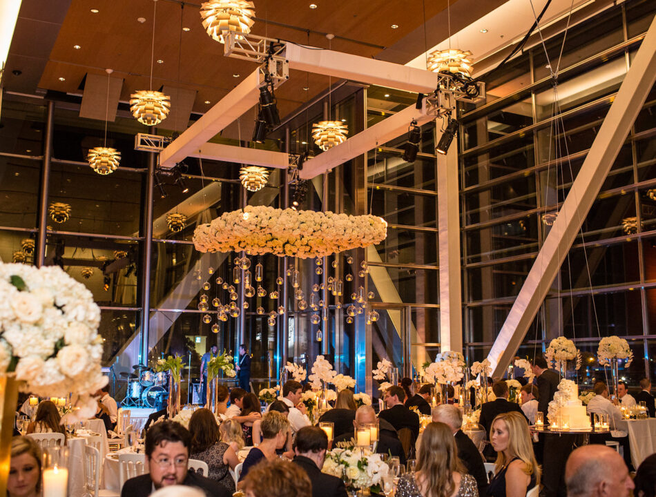 The Clinton Center Great Hall at night decorated for wedding and filled with guests