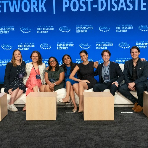 A group of staff members sit together during a Clinton Global Initiative event