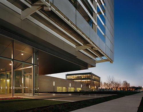 Exterior of Clinton Presidential Center building pictured at dusk