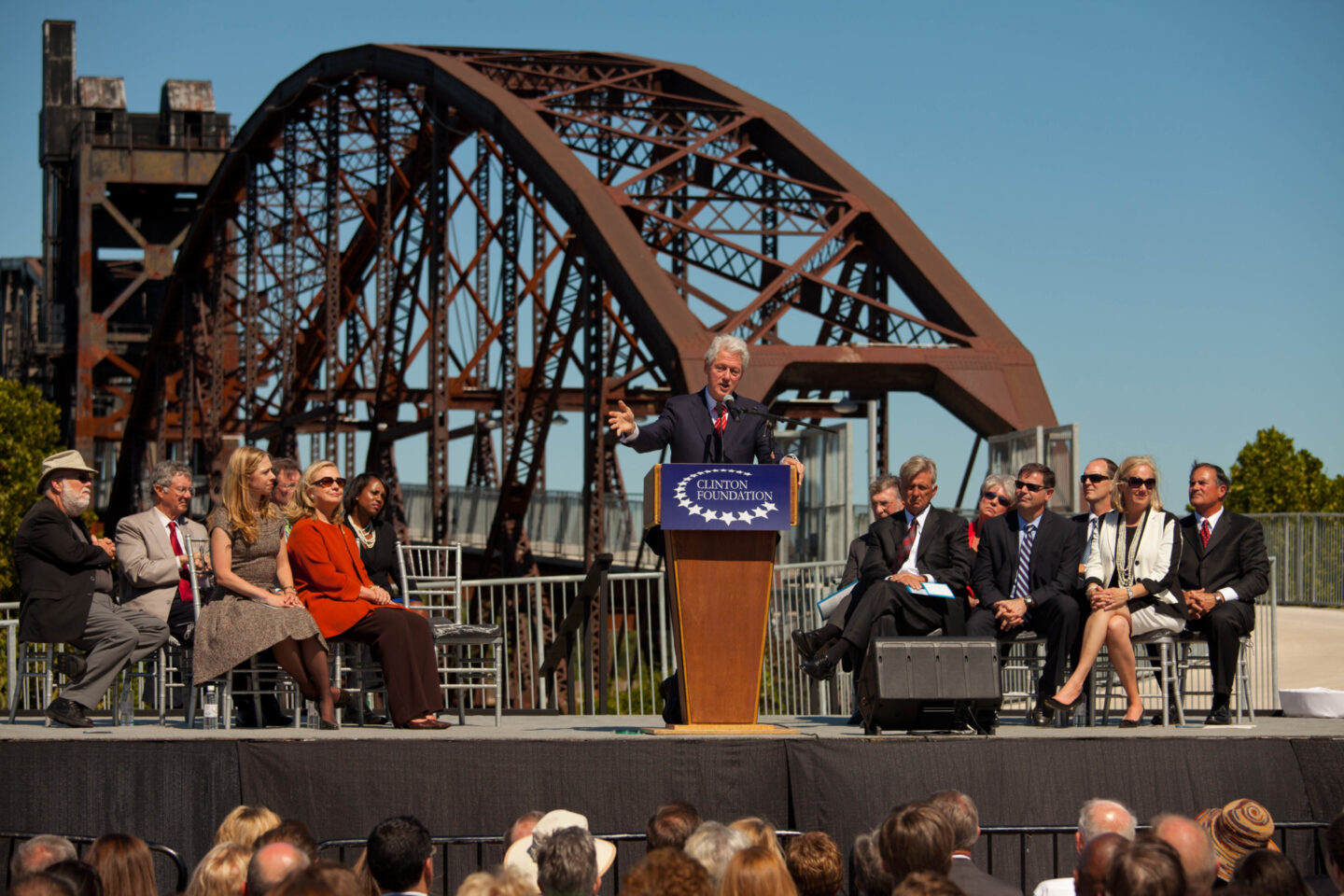 President Clinton speaks on stage at an anniversary event.