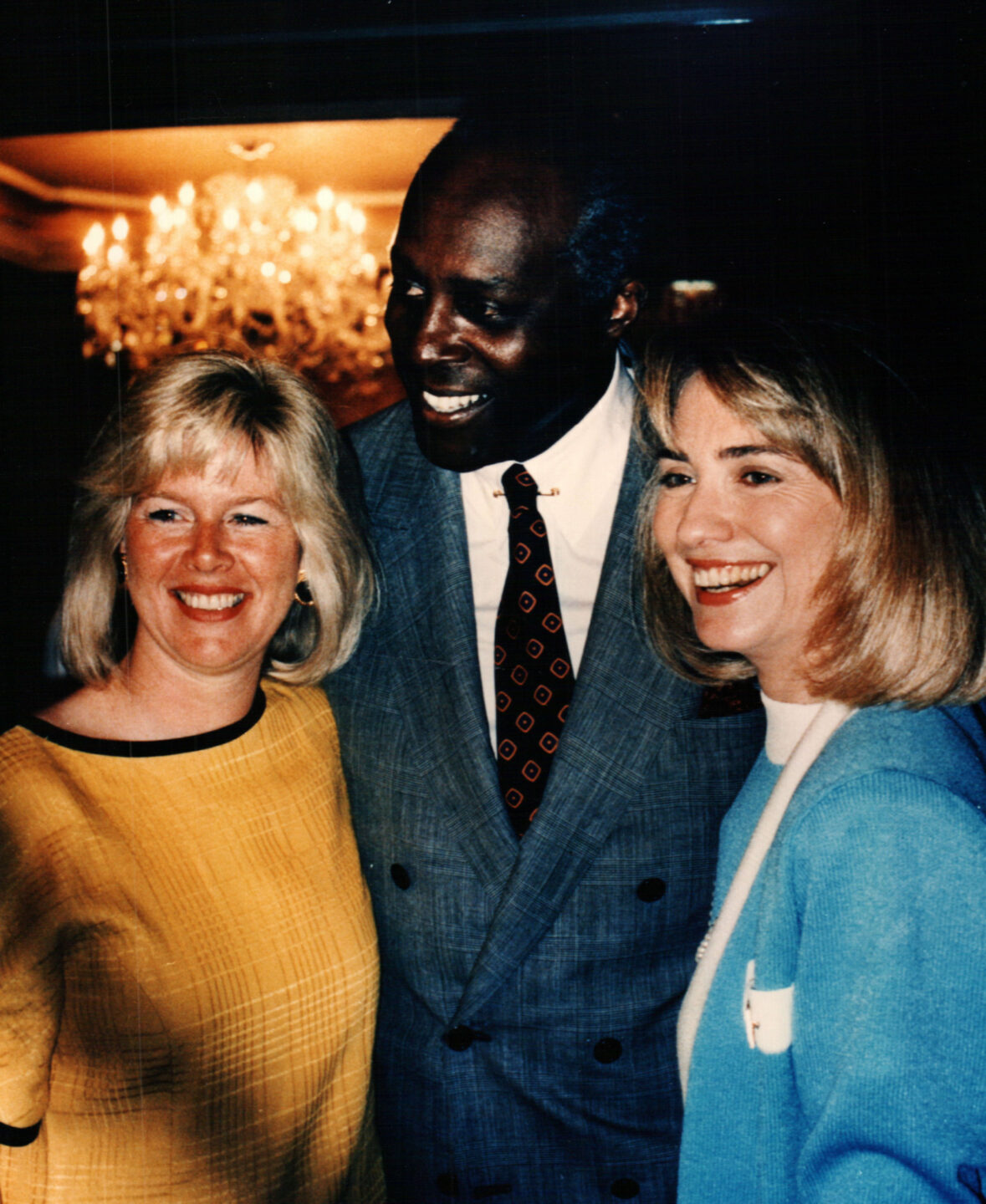 Second Lady Tipper Gore, Vernon Jordan, and First Lady Hillary Clinton take a photo together.