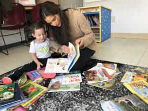 Woman reads with infant