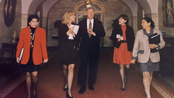 Betsy Myers, President Bill Clinton, Janet Murguia, Maria Echeveste, and Susan Brophy walk in the White House