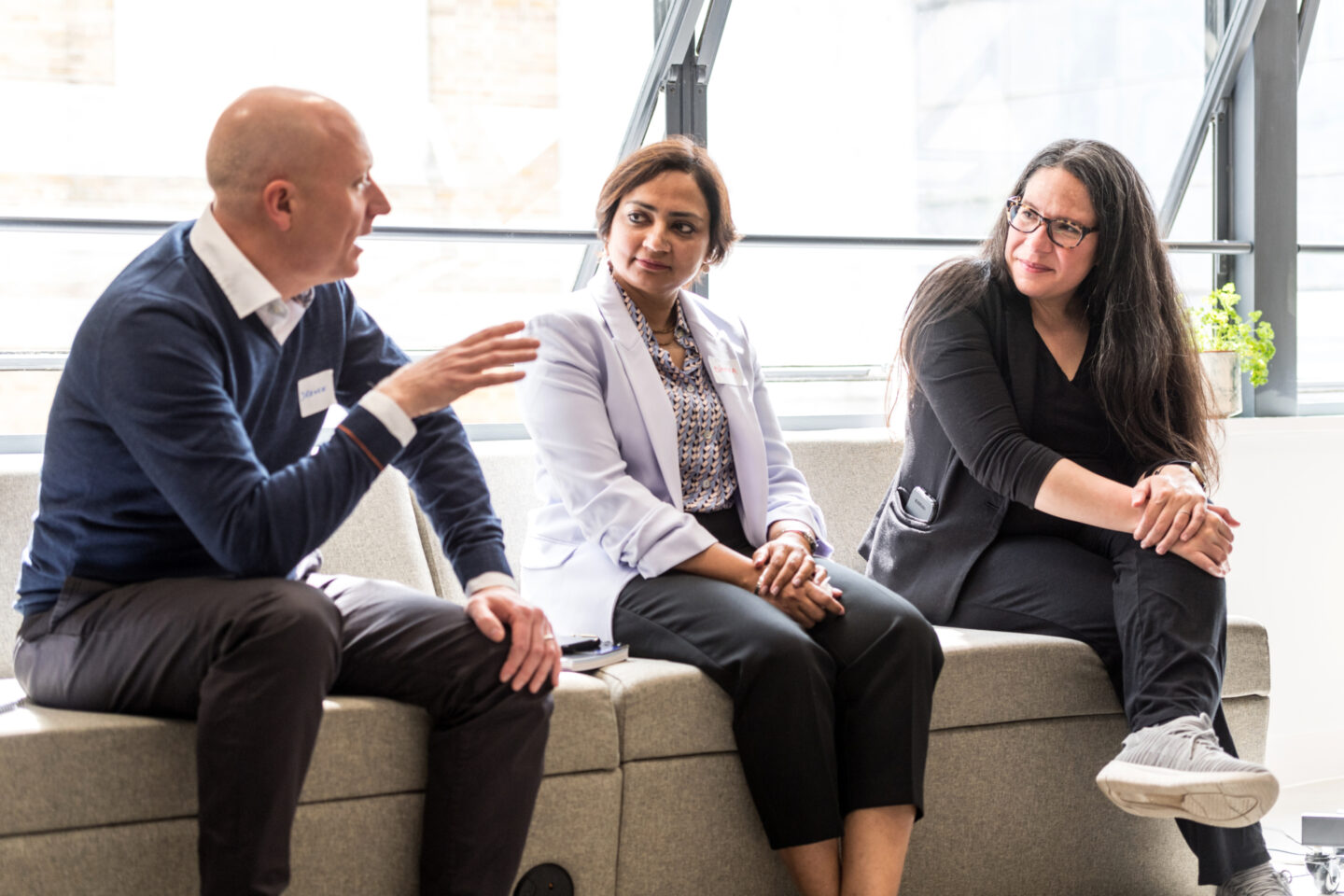 Divya Sharma speaks with two individuals