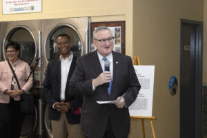 Jim Kenney speaks into a microphone