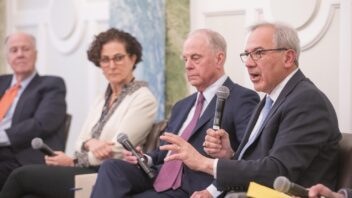 Close up of four panelists sitting on stage.