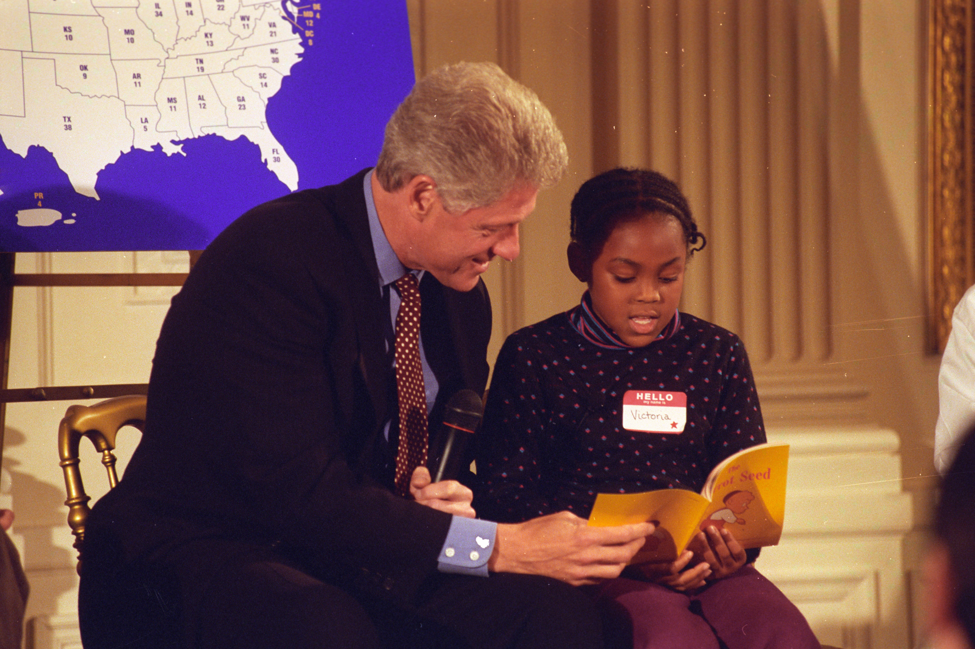 President Bill Clinton reading to a child