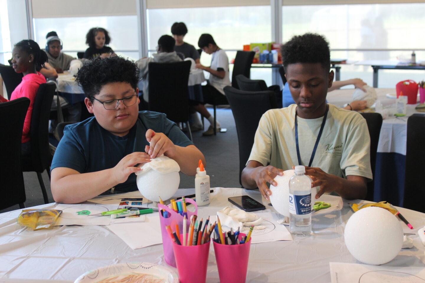 Two students working on an art project at the Clinton Center